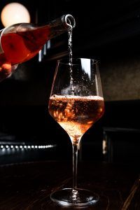 rose poured into a wine glass