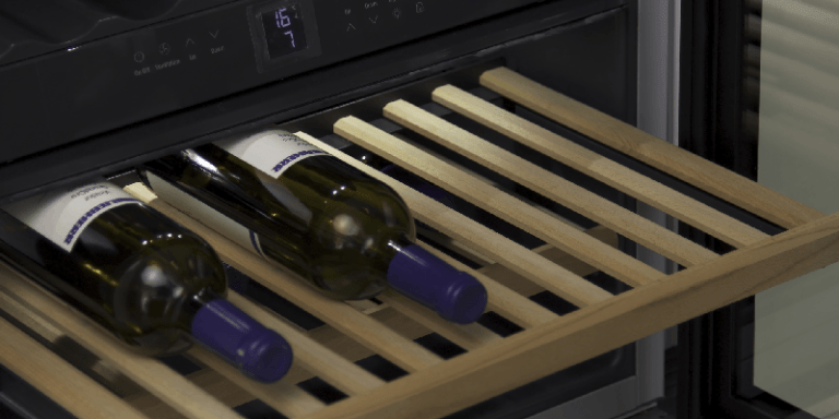 A wine cooler with several bottles of red wine on a wooden rack
