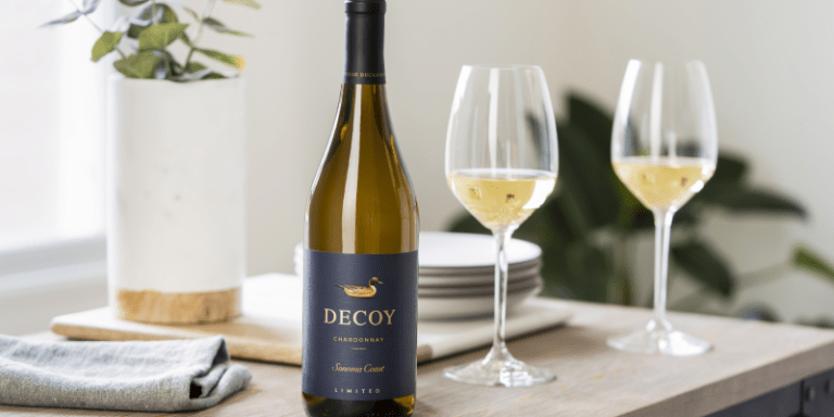 a bottle of decoy wine chardonnay next to wine glasses
