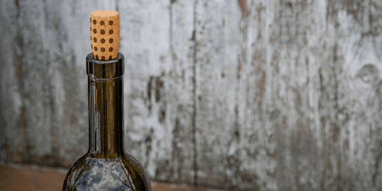an opened bottle of wine with the cork re-inserted