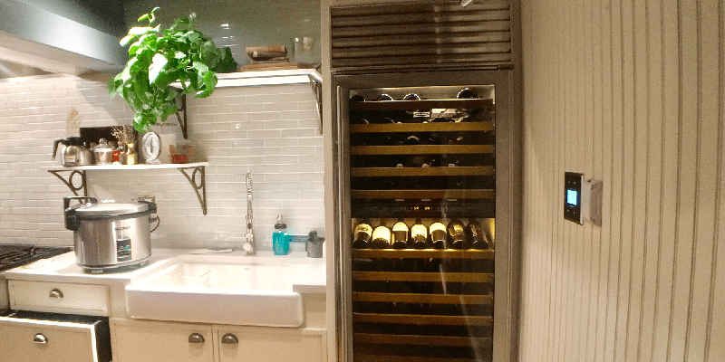 a tall wine refrigerator in a home kitchen
